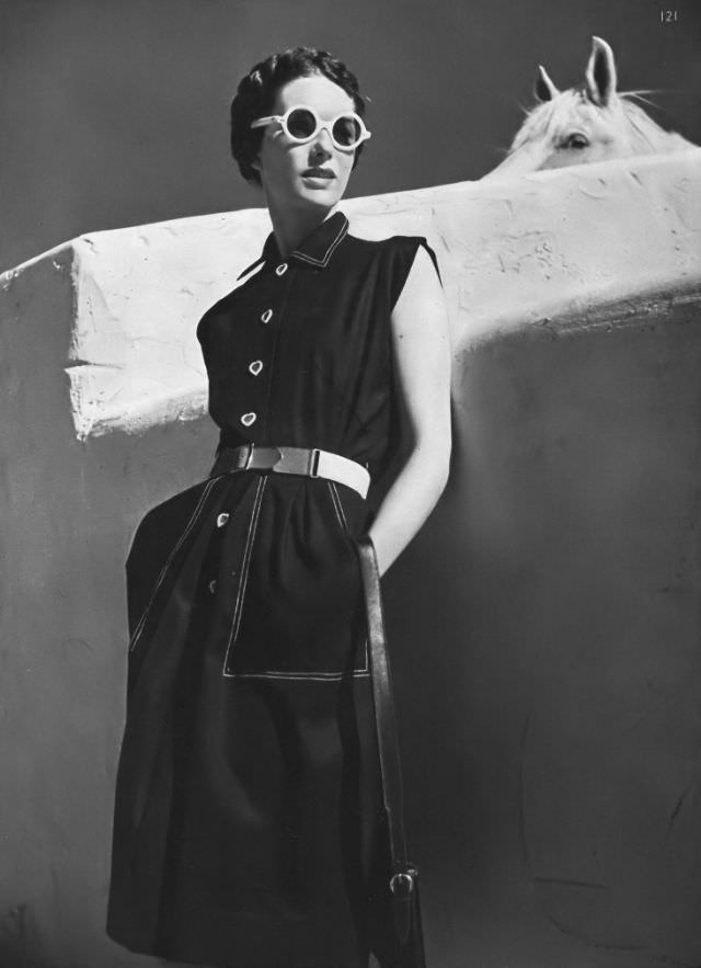 Model in spun-rayon-cotton dress with white stitiching and canvas belt by Townley, Arizona, Vogue, 1945.