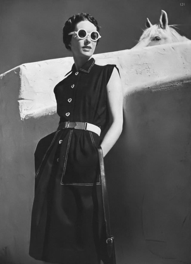 Model in spun-rayon-cotton dress with white stitiching and canvas belt by Townley, Arizona, Vogue, 1945.