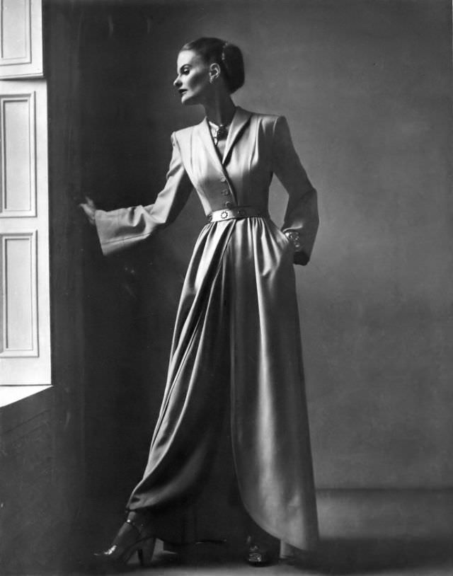 Dorothy Tivis in egg-nog beige wool cut-away hostess coat by Joseph Whitehead for Bergdorf Goodman, Vogue, 1946.
