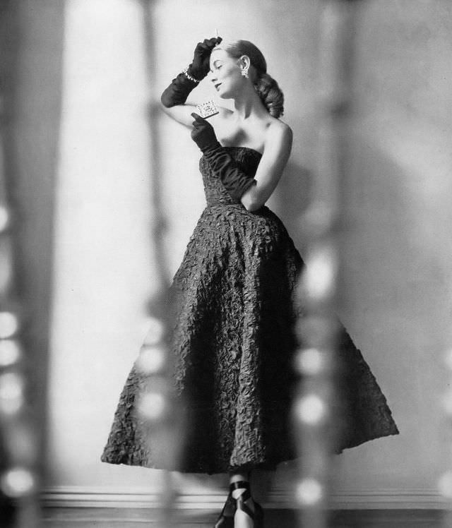 Natalie Paine in strapless but lightly boned dream dress of cloque taffeta by Ceil Chapman, jewelry by Cartier, Harper's Bazaar, 1947.