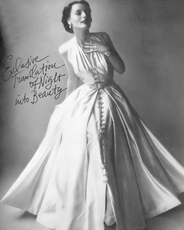 Lucille Lewis in beautiful silk-satin gown with billowing skirt exclusively at Bergdorf Goodman, Harper's Bazaar, 1948.