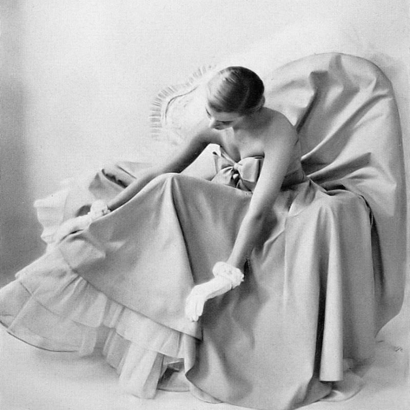Model in pink chambray strapless dress that can be worn over a full-length petticoat of dotted Swiss muslin as shown here, by Adele Simpson, Harper's Bazaar, 1948.
