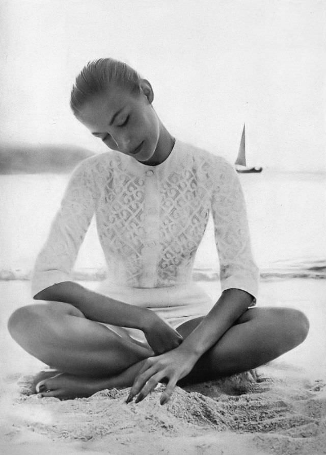 Liz Pringle in white cotton lace cardigan with matching white faille shorts by Haymaker, May 1956