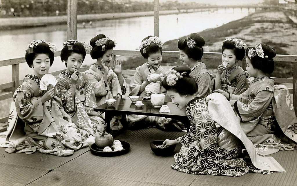 A group of Maiko girls on a balcony overlooking the Kamo River in Kyoto, late 1910s