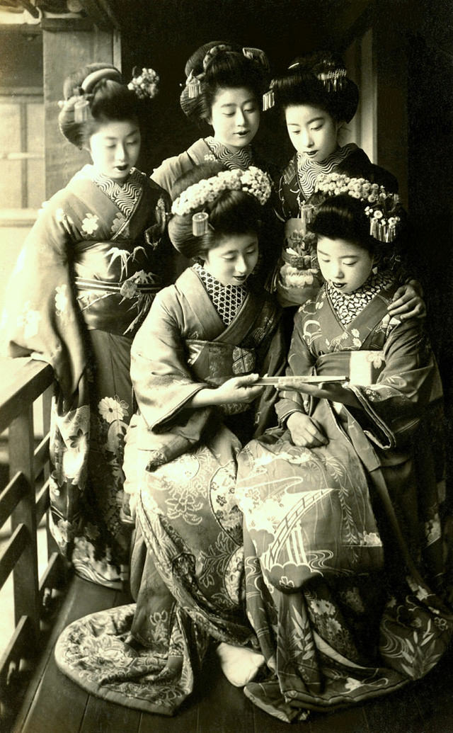 Admiring a folding fan, 1910s