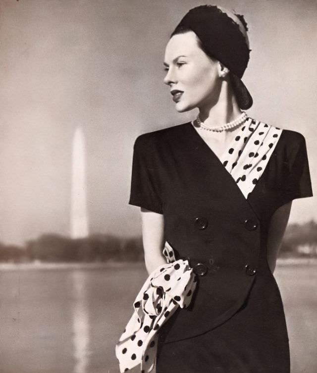 Meg Mundy in navy-blue dress interlaced with polka-dot sash by Pattullo, Harper's Bazaar, March 1946