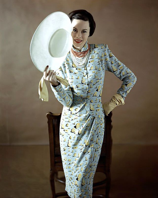 Meg Mundy in a dress and jacket printed with "Dali's Desert Rocks' from a Vogue Pattern Design S-4780, Vogue, April 1, 1947