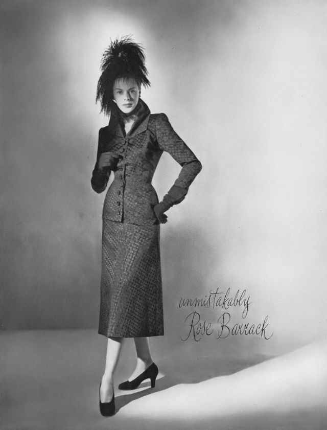 Meg Mundy in late-day suit by Rose Barrack, hat by John Frederics, Vogue, September 15, 1947