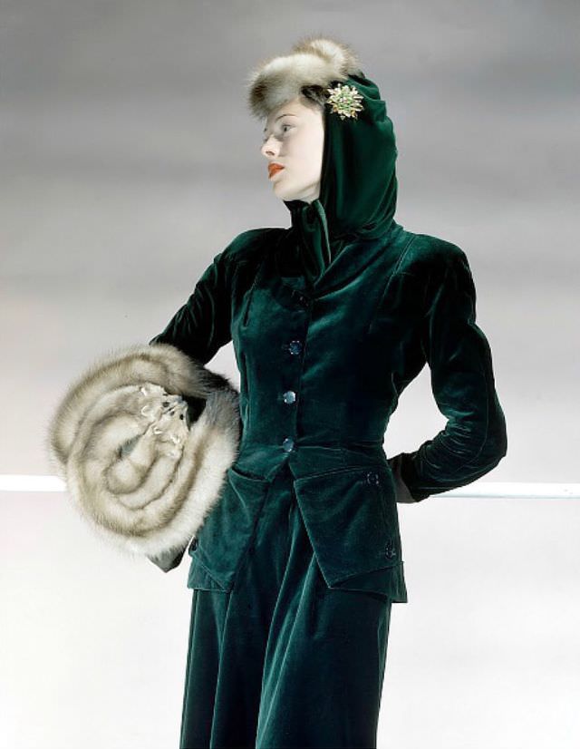 Meg Mundy wearing green velveteen suit with baum-marten hat and muff, Vogue 1941