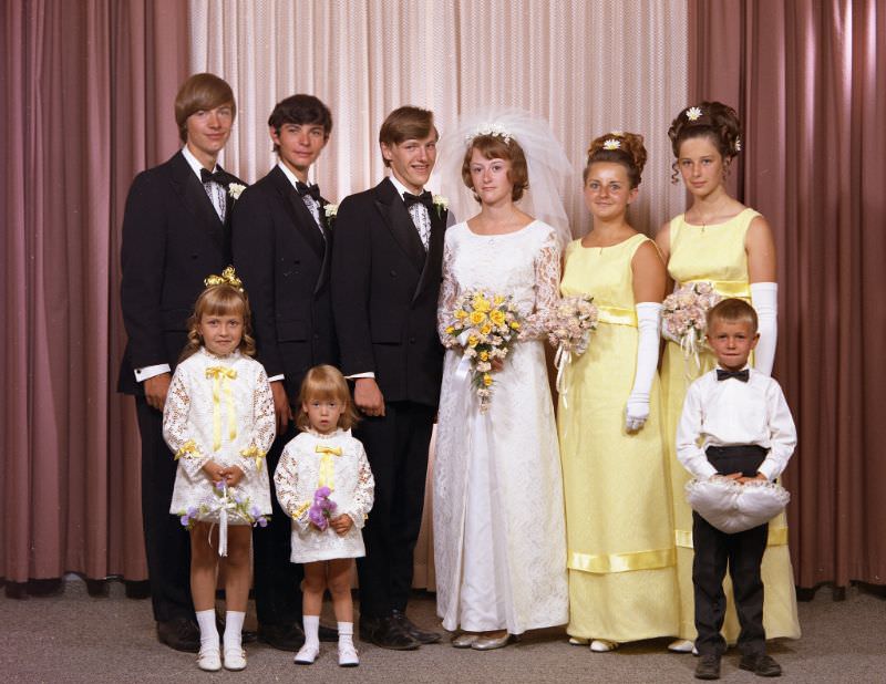 Wedding portrait of Mr. Verigin and Mrs Robert. The bride is holding a bouquet of yellow flowers, August 15, 1970