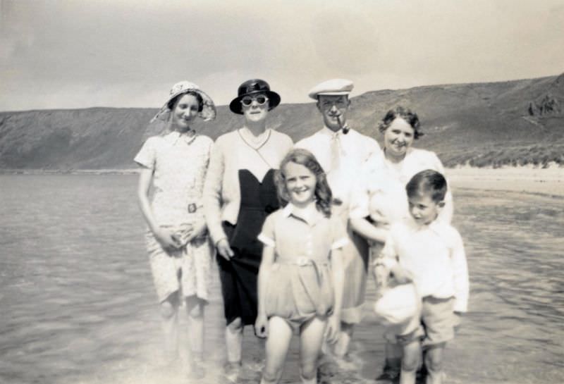 Six members of a British middle-class family posing at the seaside, 1935