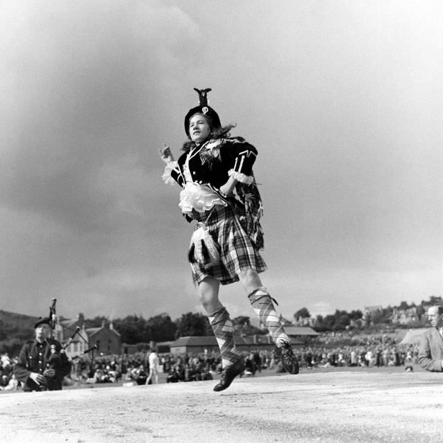 In Stewart Tartan an Aberdeen lass competed in a championship Highland dancing contest held each year at the Cowal gathering at Dunoon. Other events included piping and the fling.