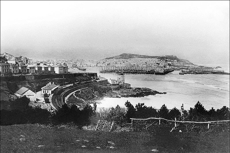 A view of the town and harbour. The track at the station appears to be broad gauge, the St. Erth branch line was the very last broad gauge line to be built, St. Ives, Cornwall