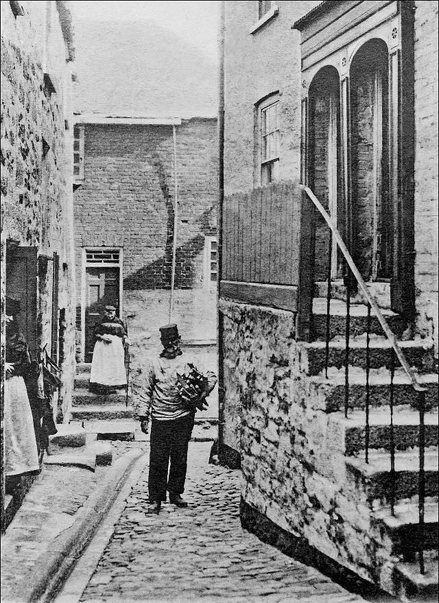 A fisherman makes his way along Virgin Street, St. Ives, Cornwall