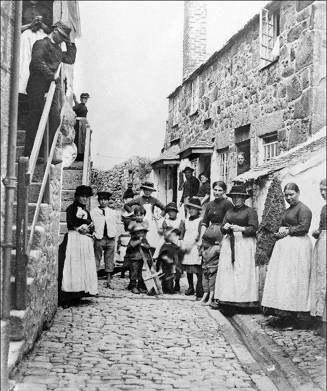 Virgin Street, with the locals posed outside of their dwellings, St. Ives, Cornwall