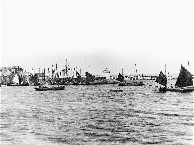 A view across the harbour showing Smeaton's Pier and lighthouse, St. Ives, Cornwall