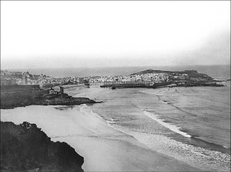 A view from the east showing Porthminster beach, Pedn-Olva mine engine house and the harbour, St. Ives, Cornwall