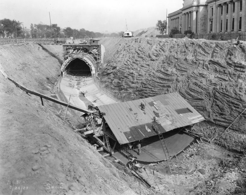 River des Peres being enclosed in a concrete tunnel in Forest Park, with the Missouri History Museum in the background, 1920s