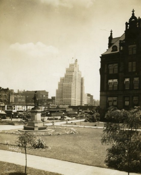 Washington Square Park with a sculpture of Pierre Laclede, as seen from City Hall, 1920s