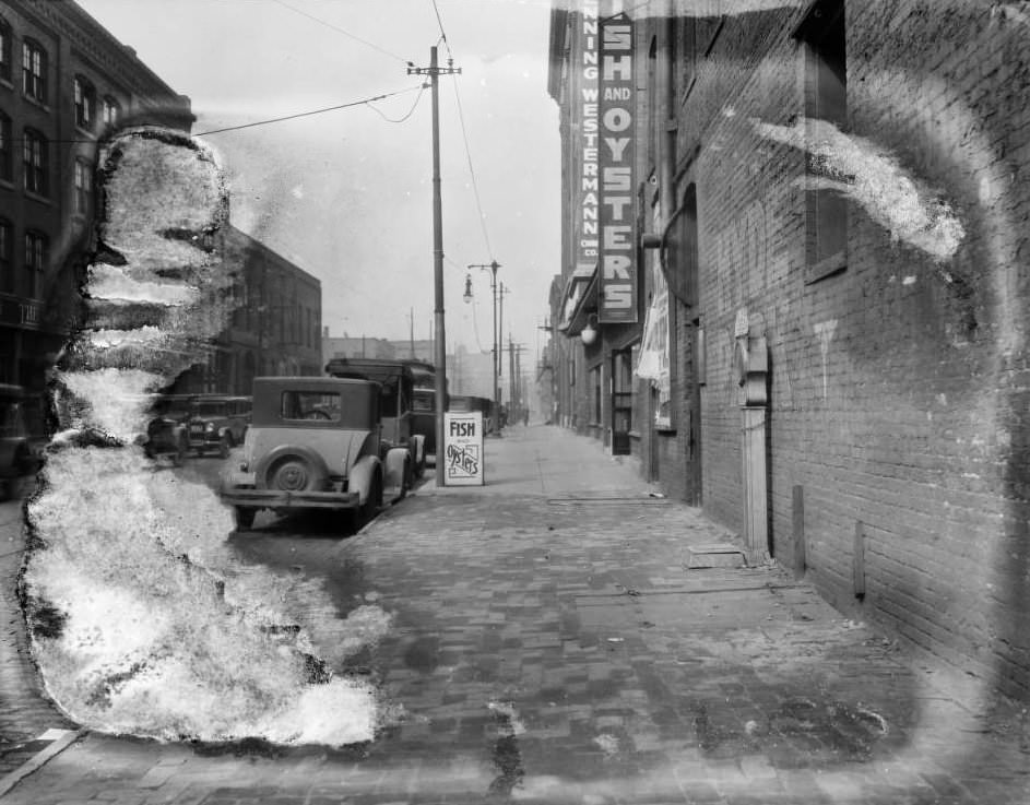 View of the 900 block of North 6th Street, with businesses such as the Brunswick-Balke-Collender Company, Leo B. Bruno's Fish and Oysters, and Krenning-Westermann China Company visible, 1925