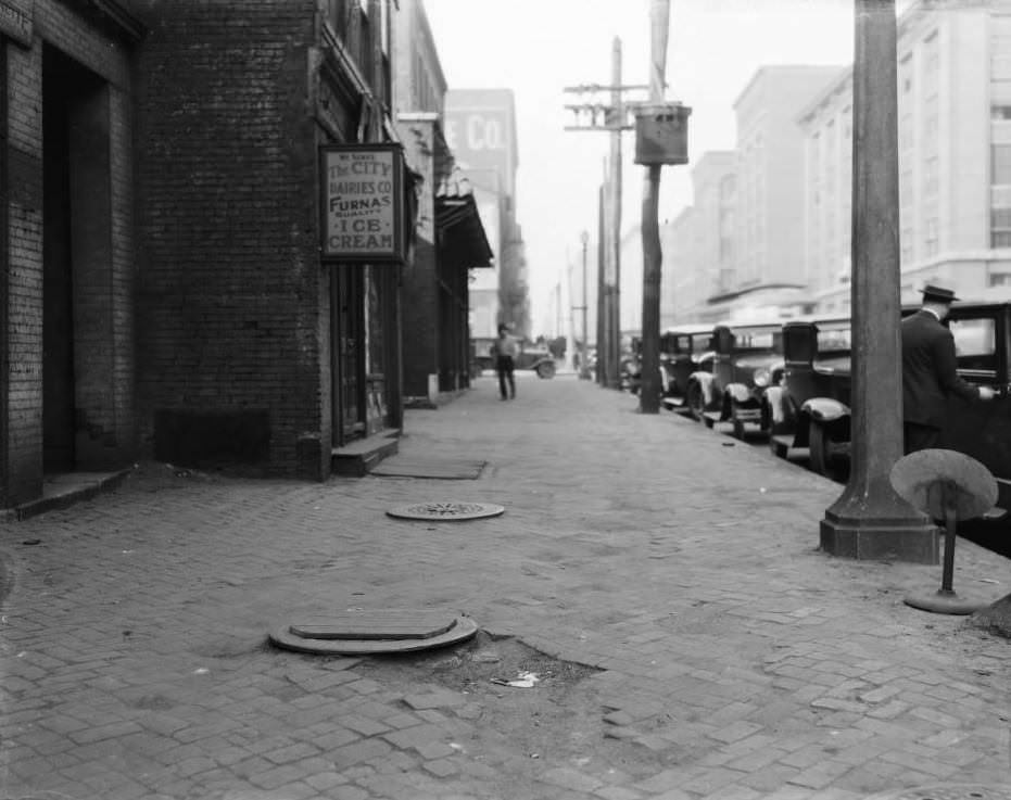 North view from 413 South Broadway towards the intersection with Spruce Street, with the Steinwender-Stoffregen Coffee Co. building at far center and Busch Stadium, 1925