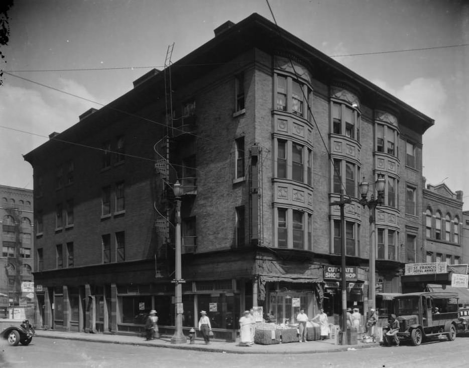 View of a four-story brick building at the corner of 700 N. Lucas and 600 W. 6th St., 1925