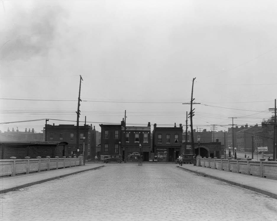 View from South Compton of several buildings on Chouteau Ave., including Dr. Eugene T. Taylor office and pharmacy, 1925