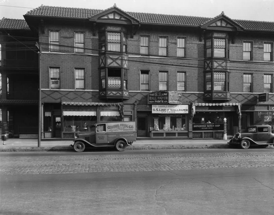 View of the Koenig Apartments and businesses on the 2300 block of South Grand between Victor and Sidney, 1925