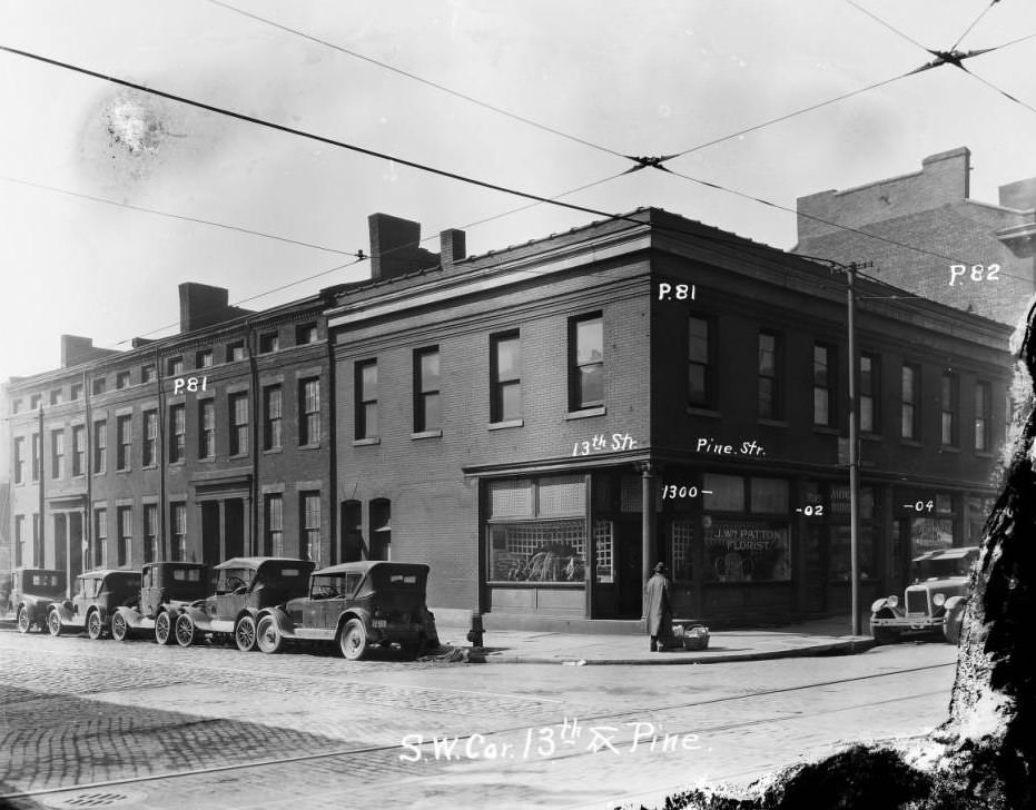 Two-story brick storefront and dwellings on 13th and Pine Street, downtown, in 1927. Currently, the site of Soldiers Memorial Military Museum, 1927