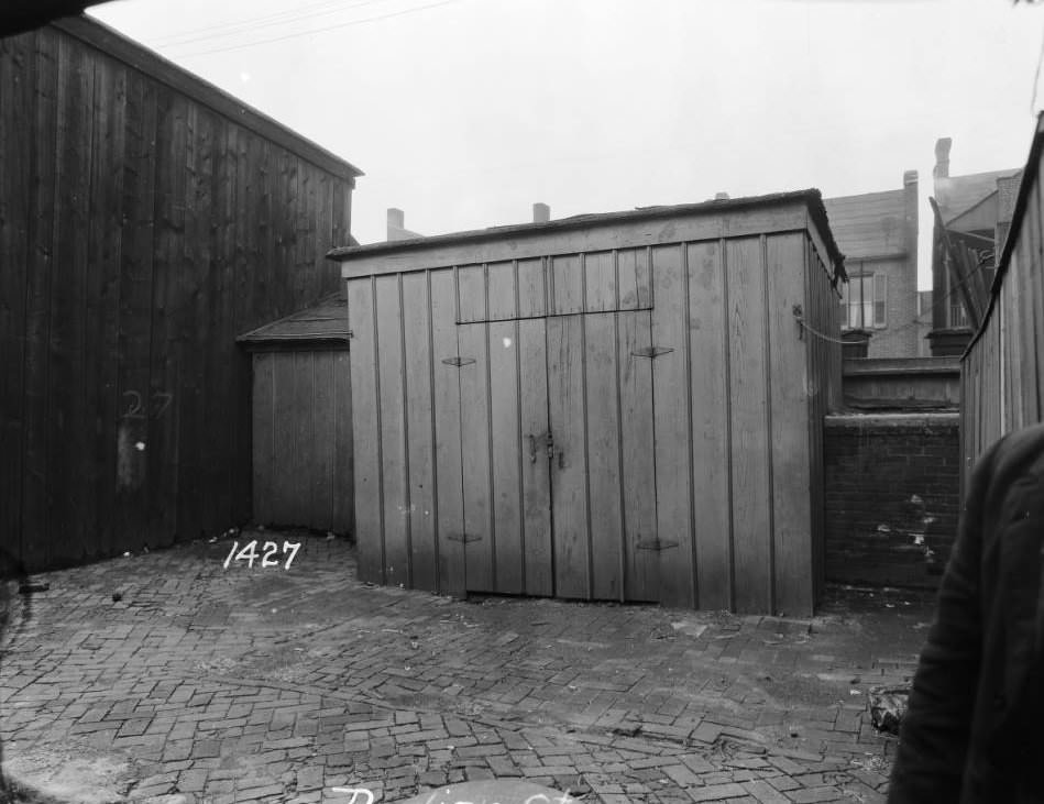 View of woodshed and cobblestones at 1427 Dodier Street, 1927