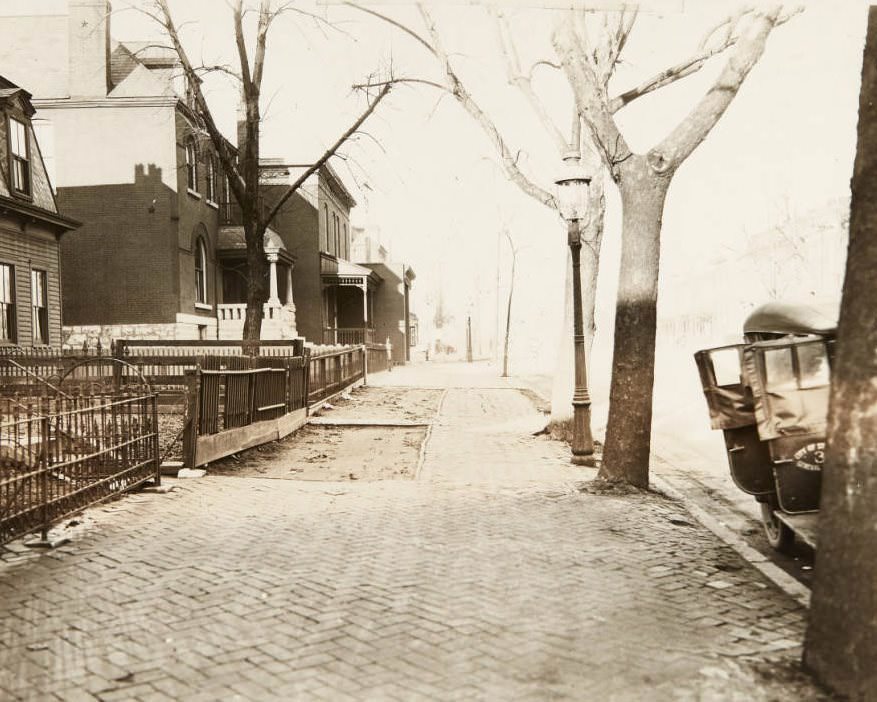 Cobblestone sidewalk and houses along North Grand, near its intersection with Lee Avenue, 1920