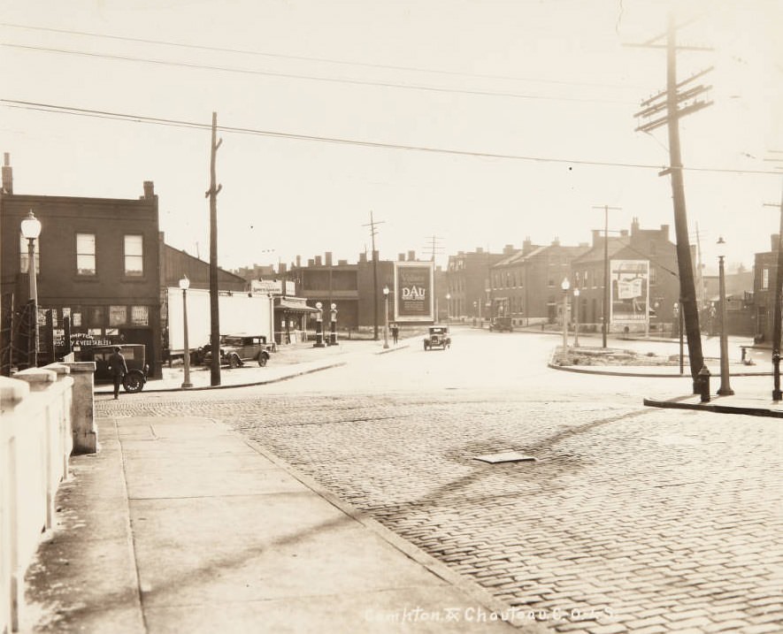 Intersection of Compton and Chouteau avenues looking south on Chouteau, with the Compton Grocery and Vegetables store and the Lubrite gas station visible on the eastern side of the street, 1920