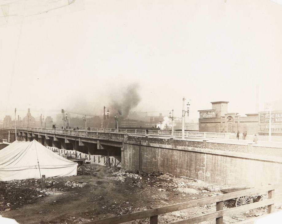 Twelth Street viaduct just south of downtown, with billboards for Hyde Park bottled beer visible on the building on the north side of the street, 1920