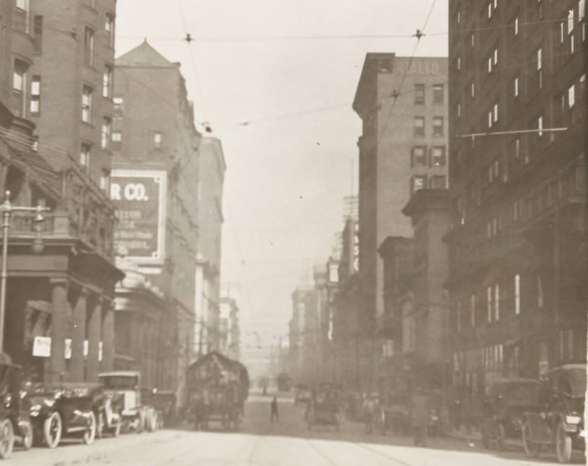 Automobiles and horse-drawn carts in traffic on Fourth Street downtown, 1920