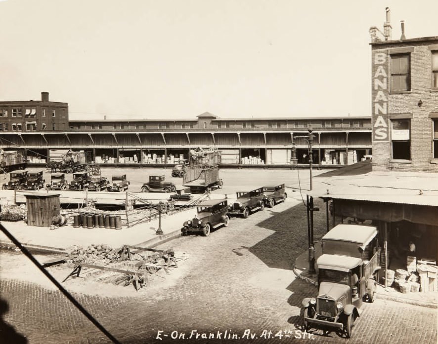 Wholesale food distribution center at Franklin Avenue and 4th Street with a "Bert Offutt Wholesale" sign in the window of the "bananas" building, 1920