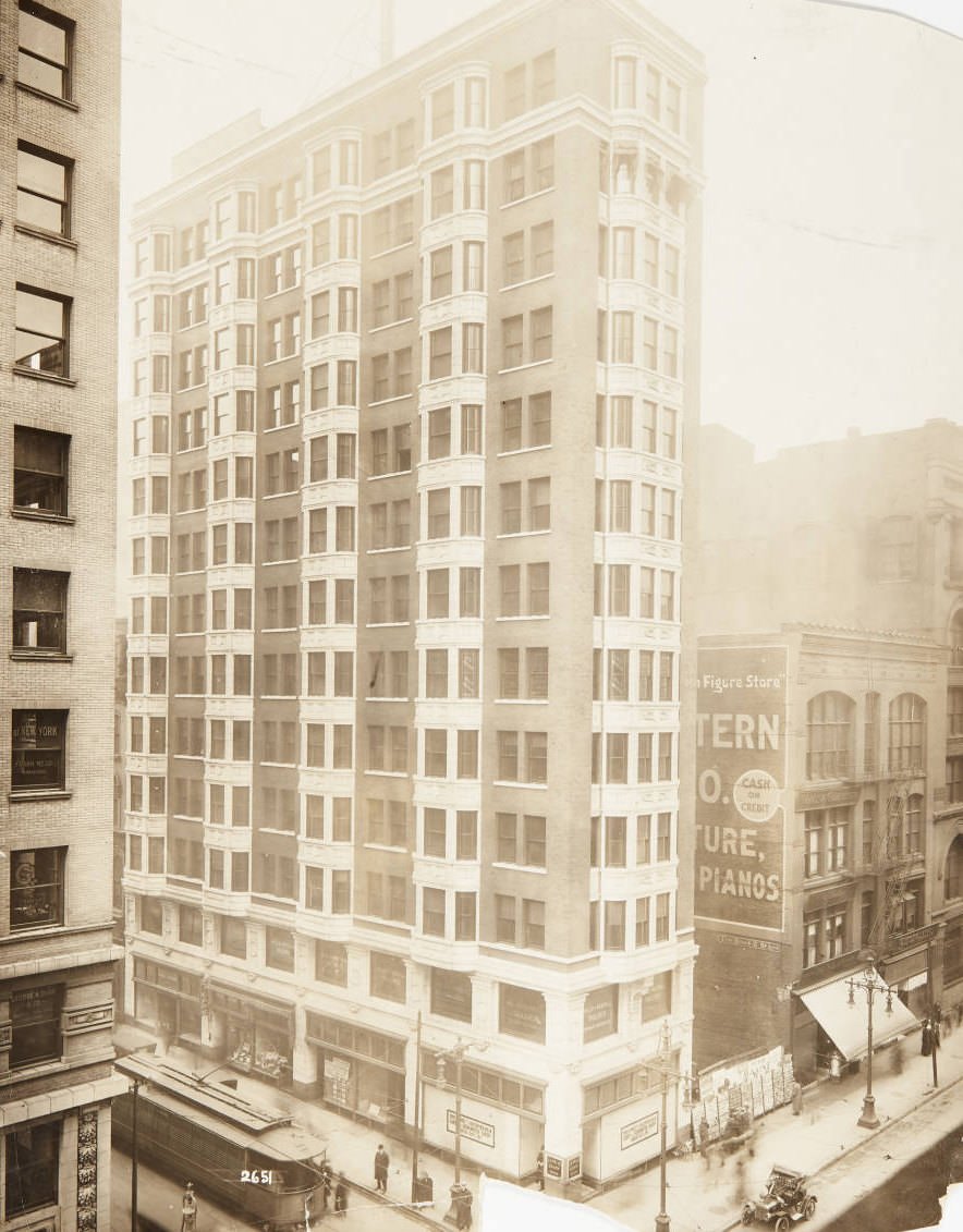 Building on the northwest corner of North Broadway and Olive Street with La Salle Candy Shop and Mills and Averill Tailors occupying the ground and second floors, respectively, 1920