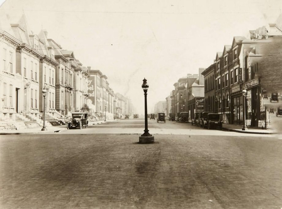 A street looking east from its intersection with Compton Ave after it was widened from 60' to 80' between Jefferson & Grand, 1920