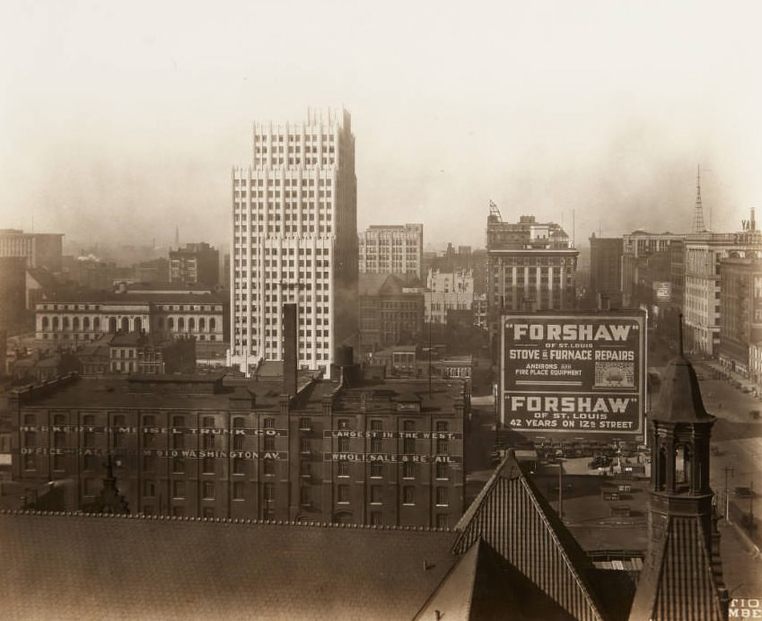 View of Central Library and the Park Pacific building from the roof of City Hall with Herkert & Meisel Trunk Co. and Forshaw Stove Repairs buildings in the foreground, 1920