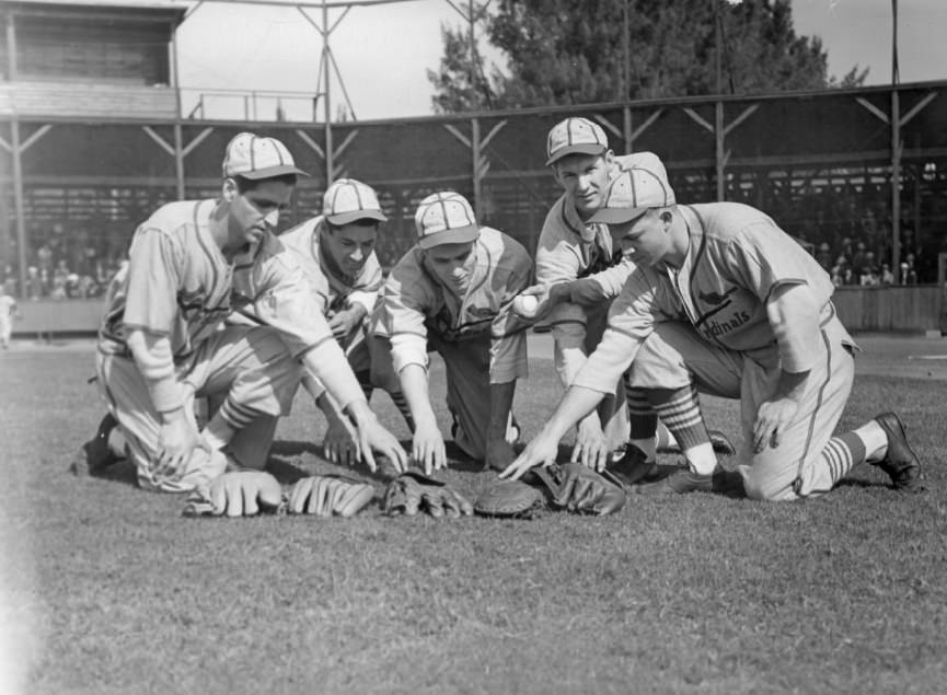 Five Cardinals Players Reaching for Gloves, 1940