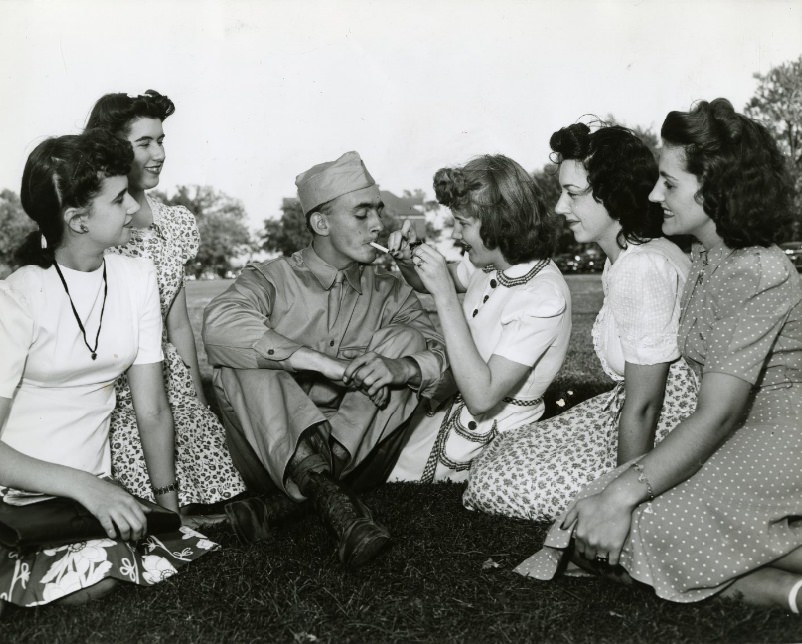 Private Russell Morrison and young ladies at Jefferson Barracks' open house, 1941.