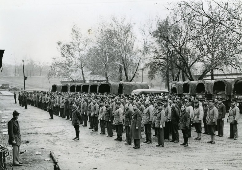 Regular army arrivals from Des Moines being checked in at Jefferson Barracks, 1940.