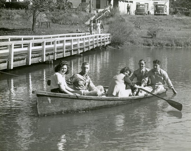 Hostesses rowing a boat, date unknown.