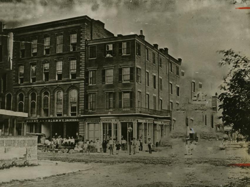 Businesses on the southeast corner of Seventh and Olive Streets in 1859, where the Famous-Barr store is now located.