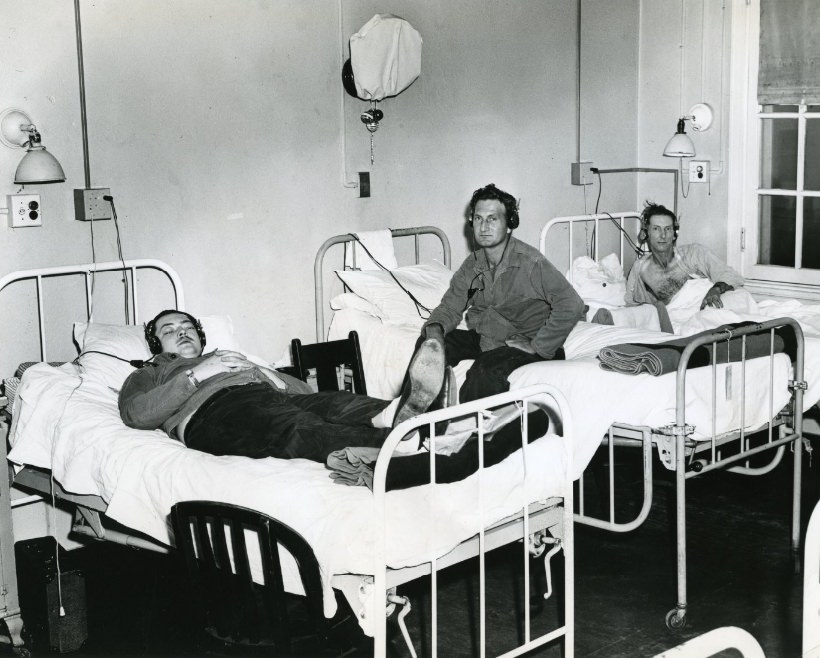 Veteran's Hospital patients with earphones at their beds, 1949.