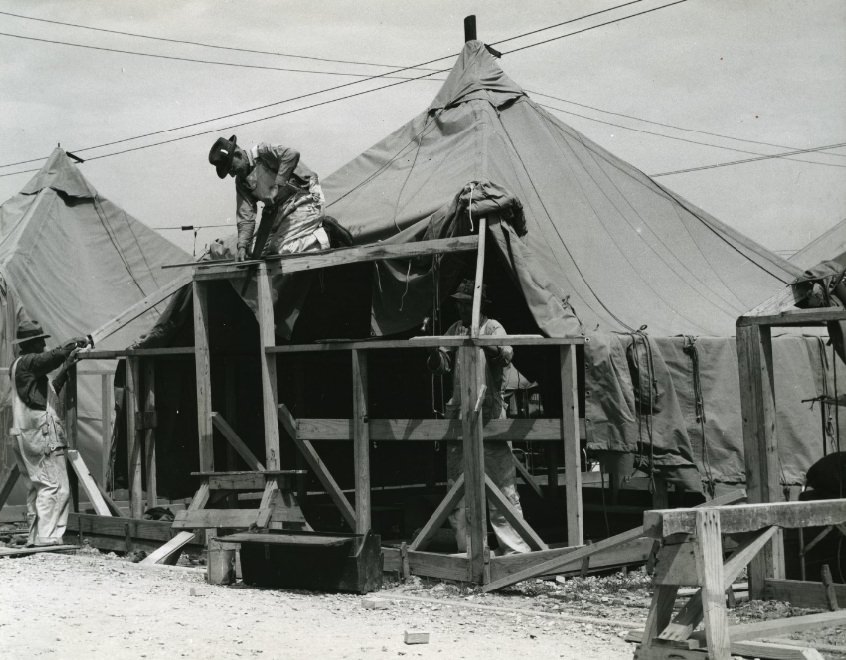 Workmen constructing tent frames at Jefferson Barracks, 1941.