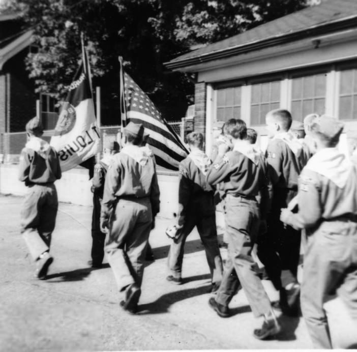 The St. Mary Magdalen Boy Scout troops march in the school parade, June, 1955.