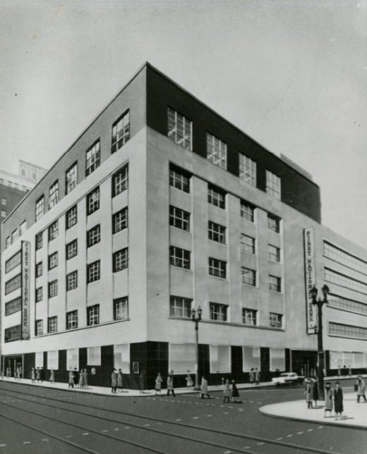 The building of the First National Bank with people passing it by, 1950