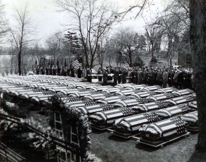 Families Of 77 Servicemen, 1951. Killed in WWII filed behind chaplains and an honor guard yesterday as they would through Jefferson Barracks National Cemetery.