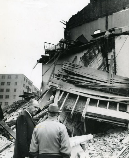 William Trantina, acting Director of Public Safety, at the scene of the collapsed building, 1209 Chouteau ave., 1960