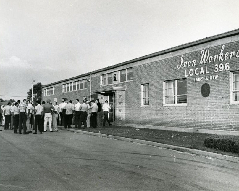 Iron workers going into the Iron Workers Union Hall for a meeting, 1960